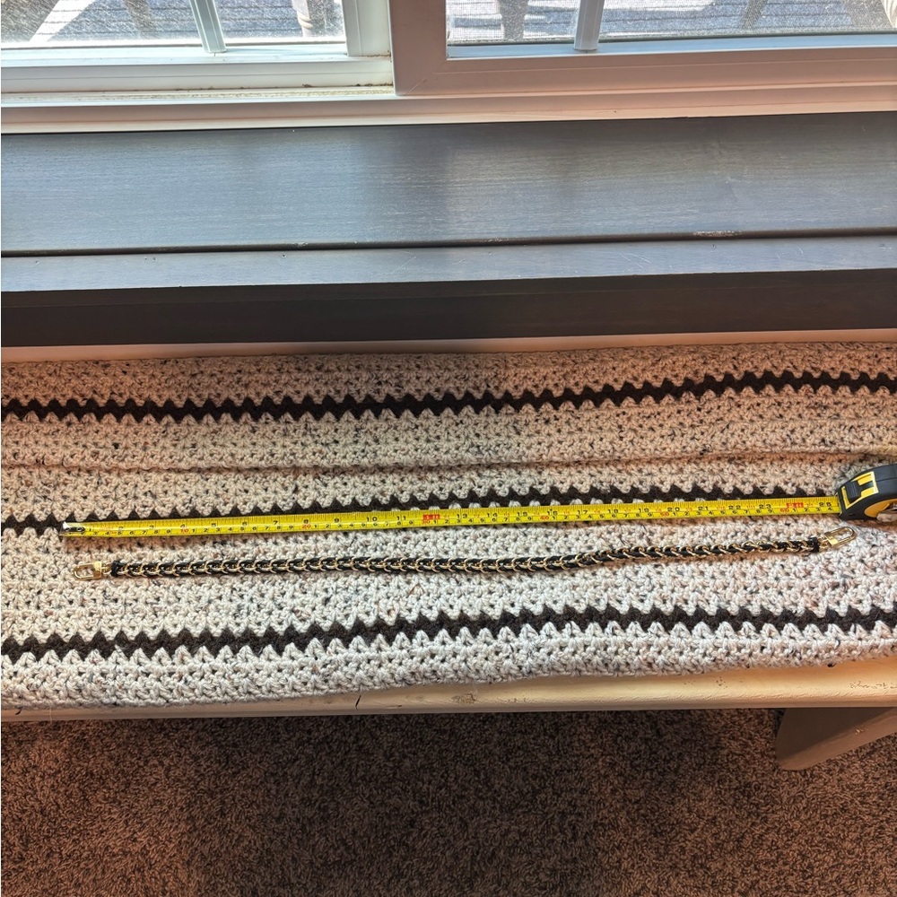Louis Vuitton black and gold chain purse strap.